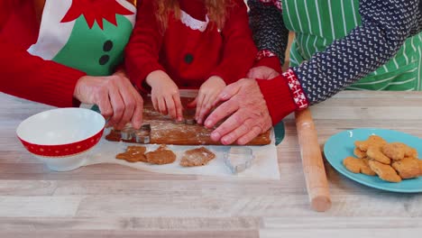 Senior-old-grandparents-with-grandchild-girl-kid-preparing,-cooking-cookie-at-home-Christmas-kitchen