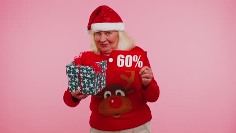 Grandmother-in-Christmas-sweater-showing-gift-box-and-60-Percent-discount-inscriptions-banner-text