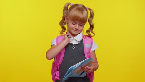 Attractive-teenage-girl-kid-in-school-uniform-smiling,-make-pencil-notes-in-a-notebook,-education