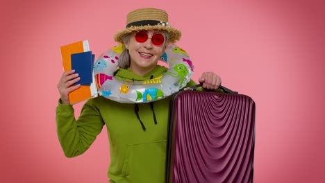 Traveler-tourist-senior-woman-granny-celebrating,-holding-passport-tickets,-luggage,-summer-vacation