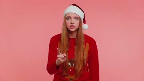 Displeased-girl-in-Christmas-sweater-gesturing-hands-with-displeasure,-blaming-scolding-for-failure