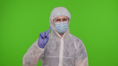Doctor-in-PPE-protective-suit-disapproving-showing-warning-rejecting-dangerous-no-sign-on-chroma-key
