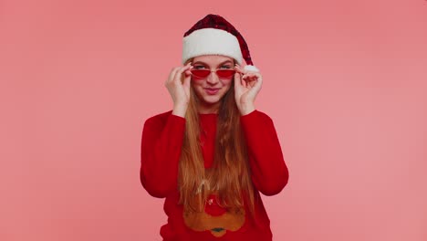 Woman-in-Christmas-sweater-listening-music-via-earphones,-dancing-disco-fooling-around-having-fun