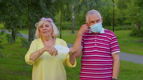 Quarantine-Coronavirus-is-over,-senior-old-family-grandparents-take-off-medical-masks,-celebrate