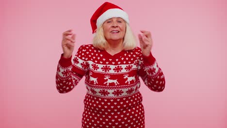 Senior-Christmas-old-grandmother-woman-listening-music-via-earphones,-dancing-disco,-fooling-around