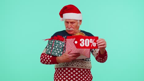 Senior-man-in-Christmas-sweater-showing-gift-box-and-30-Percent-discount-inscriptions-banner-text