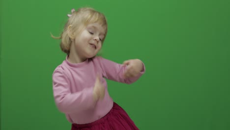 Happy-three-years-old-girl.-Cute-blonde-child.-Dancing-and-make-faces