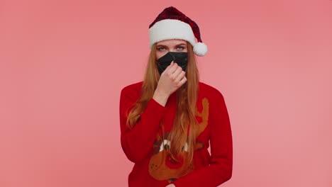 Woman-in-Christmas-red-sweater-wearing-face-mask-ppe-to-safe-from-coronavirus-on-lockdown-quarantine