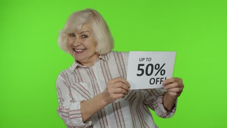 Senior-grandmother-showing-Sale-50-percent-Off-banner-advertisement.-Online-shopping.-Black-Friday