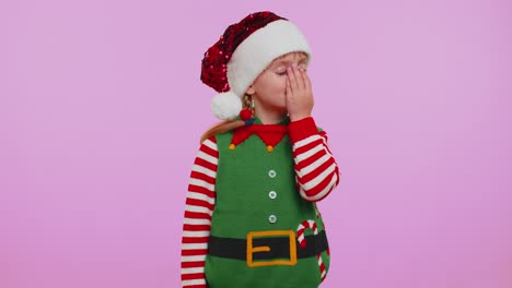 Upset-girl-in-Christmas-costume-making-face-palm-gesture,-feeling-bored,-disappointed,-bad-result