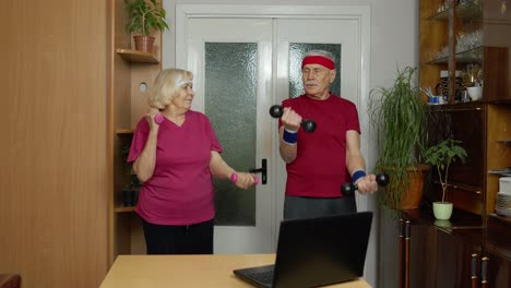 Senior-elderly-couple-grandmother-grandfather-doing-workout-with-dumbbells,-fitness-exercising