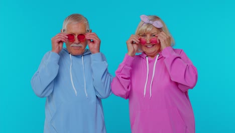 Seductive-senior-gray-haired-stylish-grandfather-grandmother-wearing-sunglasses,-charming-smile