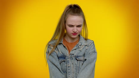 Dissatisfied-teen-girl-asking-reason-of-failure,-expressing-disbelief-irritation,-feeling-bored