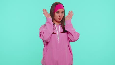 Student-girl-in-pink-hoodie-closing-eyes-showing-stop-gesture,-confused-shy-scared-to-watch