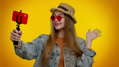Girl-traveler-blogger-in-sunglasses,-taking-selfie-on-mobile-phone,-communicating-video-call-online