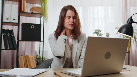 businesswoman-suffers-from-spine-neck-muscle-pain-at-home-office-working-on-laptop-overworking