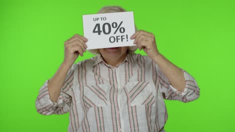 Senior-grandmother-showing-Sale-40-percent-Off-banner-advertisement.-Online-shopping.-Black-Friday