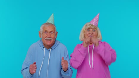 Senior-retired-couple-man-woman-grandparents-shouting,-celebrating-success-winning,-goal-achievemen