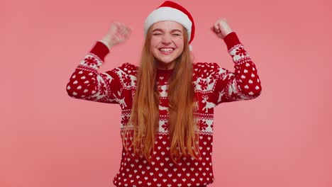 Cheerful-girl-in-red-sweater-Christmas-Santa-shouting,-celebrating-success,-winning,-goal-achievemen