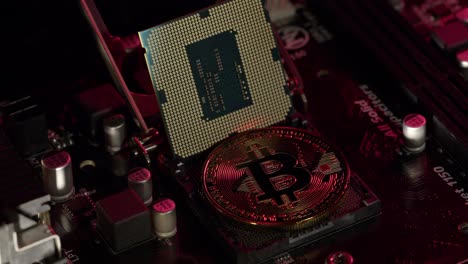 Bitcoin-BTC-and-CPU-central-processor-on-digital-technology-pc-motherboard,-mining-cryptocurrency