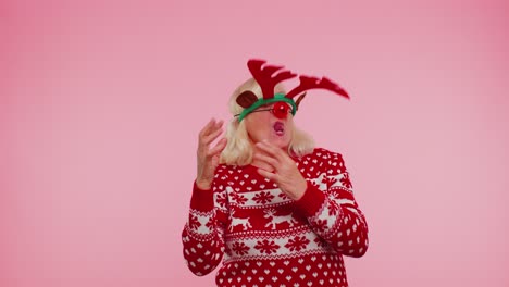 Senior-Christmas-grandmother-woman-with-deer-antlers-listening-music,-dancing-disco,-fooling-around