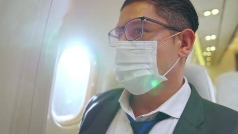 Traveler-wearing-face-mask-while-traveling-on-commercial-airplane-.