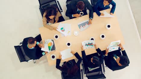 Business-people-group-meeting-shot-from-top-view