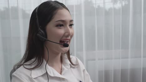 Young-enthusiastic-female-customer-support-operator-put-on-headphone.