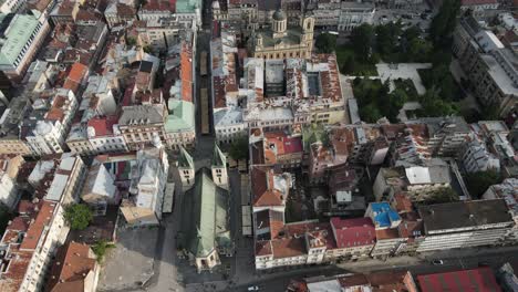 Drone-view-of-the-church-located-in-the-city-center-of-Bosnia,-a-city-with-different-religions,-aerial-view-of-historical-buildings