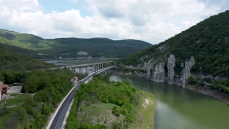 Drone-toward-bridges-crossing-Tsonevo-reservoir-next-to-striking-rock-formations