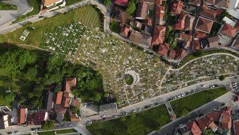 Aerial-drone-view-of-mausoleums-built-for-people-who-died-in-the-war,-view-of-the-cemetery-built-in-the-middle-of-the-city