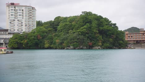 Boats-and-Hotels-in-the-Toba-bay-area-in-Mie-Prefecture,-Slow-Motion-Pan