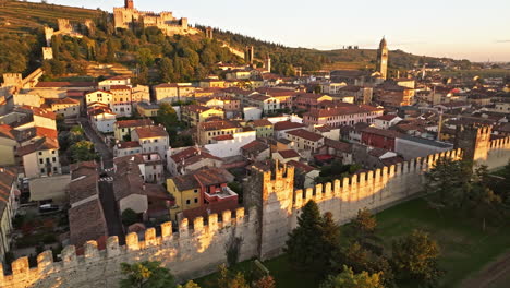Medieval-Scaliger-Turreted-Walls-In-Soave-Town-During-Golden-Hour-In-Northern-Italy