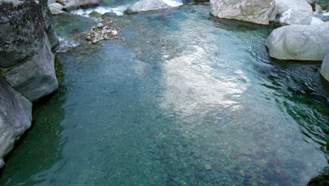 A-beautiful-calm-water-current-over-the-rocks-in-a-valley