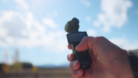 Hand-Pressing-Function-Button-Of-DJI-Osmo-Pocket-Outdoor