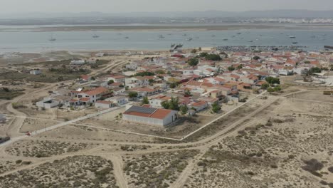 Algarve,-Portugal---The-Seaside-Residences-on-Armona-Island-on-a-Summer-Day---Aerial-Drone-Shot