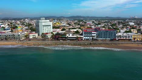 Aerial-tracking-shot-of-beaches-and-the-cityscape-of-Mazatlan,-in-sunny-Mexico