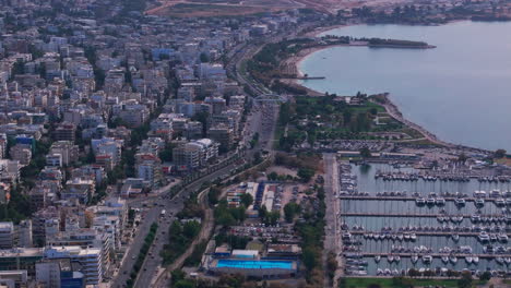 Tight-dolly-back-aerial-shot-over-Athens-seafront-and-marina