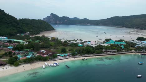 Panning-aerial-view-of-boat-traffic-at-Phi-Phi-island-pier-and-ton-sai-beach