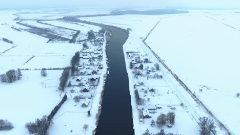 Aerial-view-The-village-is-located-near-the-river-in-winter