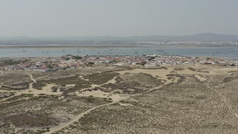 Algarve,-Portugal---Seaside-Residences-Located-Along-the-Shoreline-on-Armona-Island---Drone-Flying-Forward--