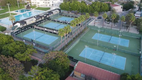 Aerial-of-outdoor-tennis-courts-and-pool-in-sports-complex