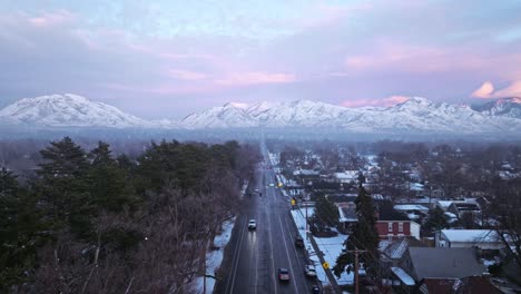 Cold-icy-side-road-leads-straight-to-epic-snow-covered-mountain-ridgelines-of-the-Wasatch-in-Salt-Lake-City
