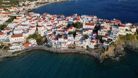 Aerial-drone-bird's-eye-view-video-of-iconic-and-picturesque-Andros-island-chora,-Cyclades,-Greece
