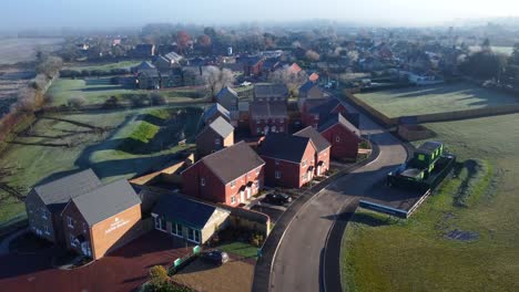 New-build-low-cost-housing-estate-and-homes-in-countryside-of-England