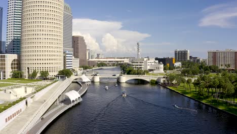 Aerial-view-of-boats-along-downtown-Tampa-riverwalk,-Willoughby-River