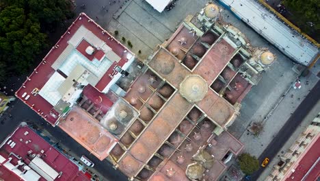 Aerial-of-historic-cross-shaped-Catholic-church-in-Oaxaca-de-Juarez---Mexico