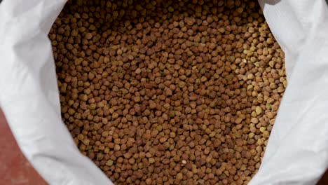 black-chickpeas-or-kala-chana-for-sale-at-retail-shop-from-top-angle-at-day
