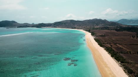Drone-Flying-High-Above-Tropical-Beach-in-Lombok,-Indonesia