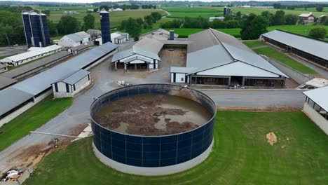 American-farm-with-a-large-manure-storage-tank-and-barns